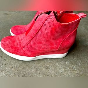 Coral colored high top sneakers